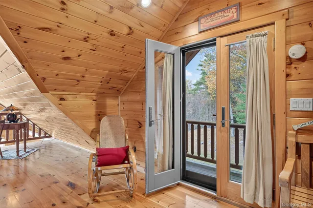 a view of a two chairs on the roof deck