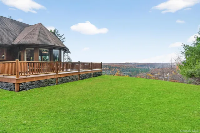 a front view of a house with a yard table and chairs