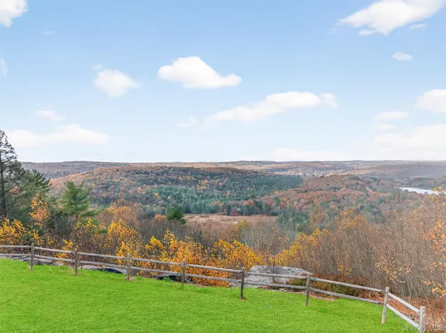 an aerial view of a house with a yard and fountain