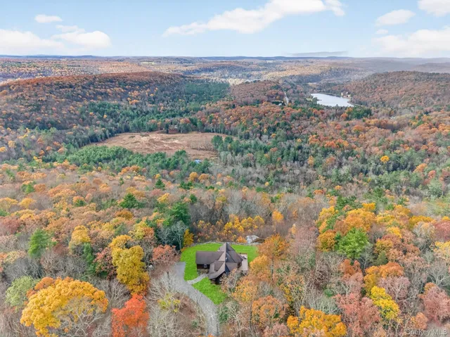 a view of lake with houses in the back