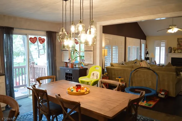 a view of a dining room with furniture window and outside view