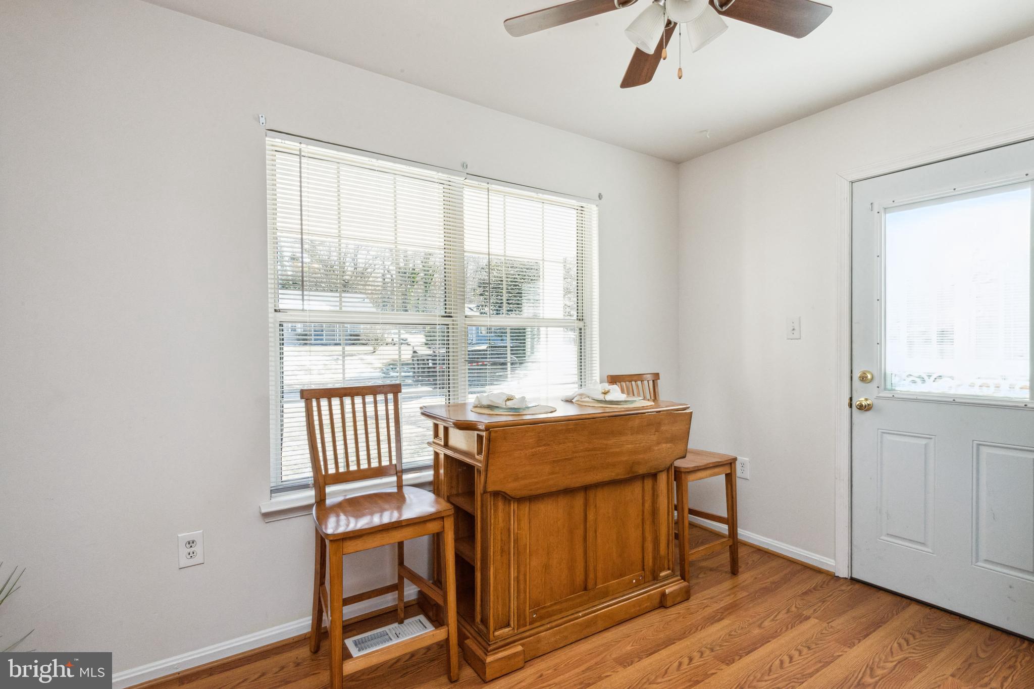 7419 Bentree Road Fort Washington, MD 20744 - Photo 12 of 31 a view of a dining room with furniture window and wooden floor