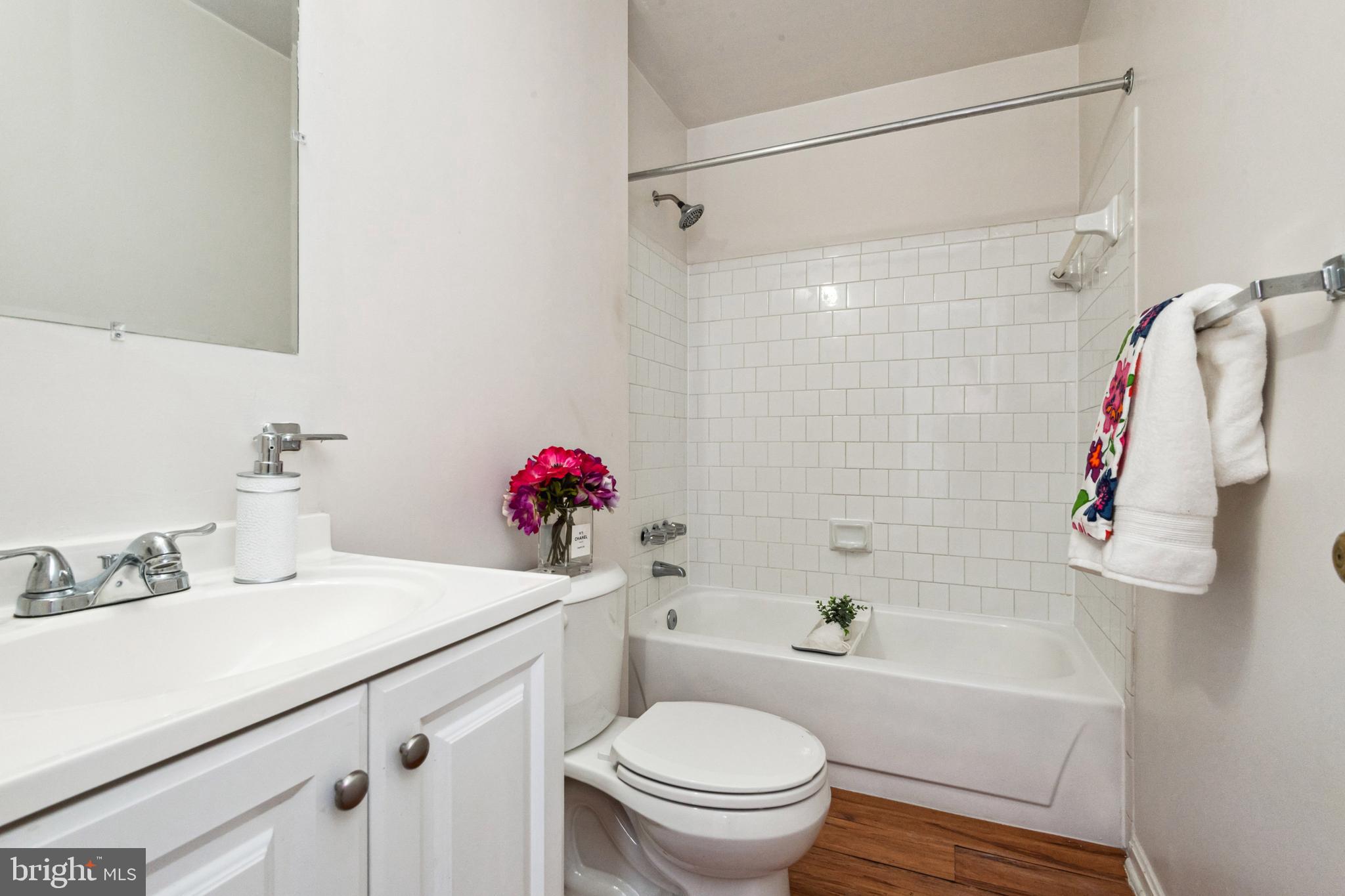 7419 Bentree Road Fort Washington, MD 20744 - Photo 14 of 31 a bathroom with a sink toilet and shower