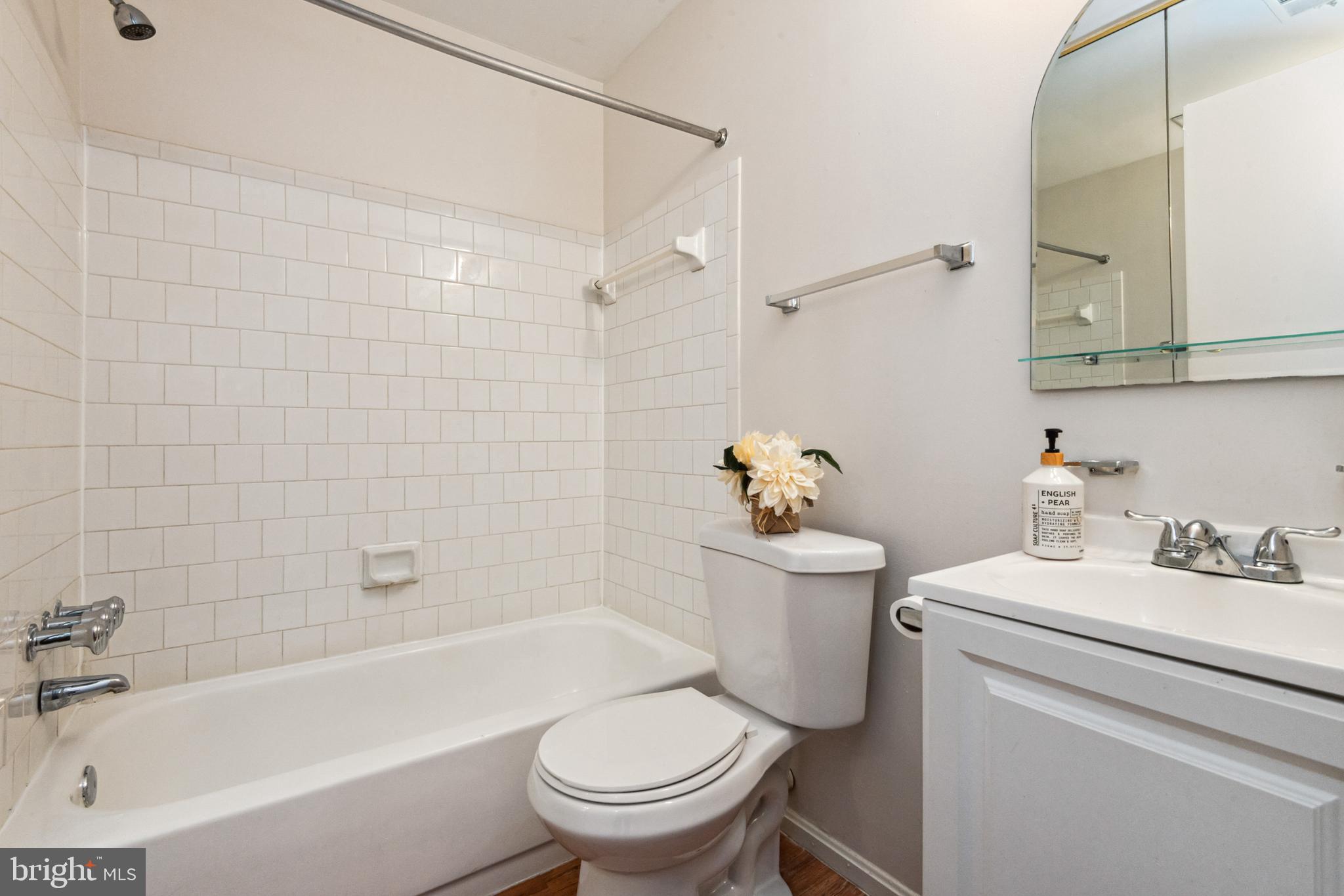 7419 Bentree Road Fort Washington, MD 20744 - Photo 17 of 31 a bathroom with a sink toilet and shower