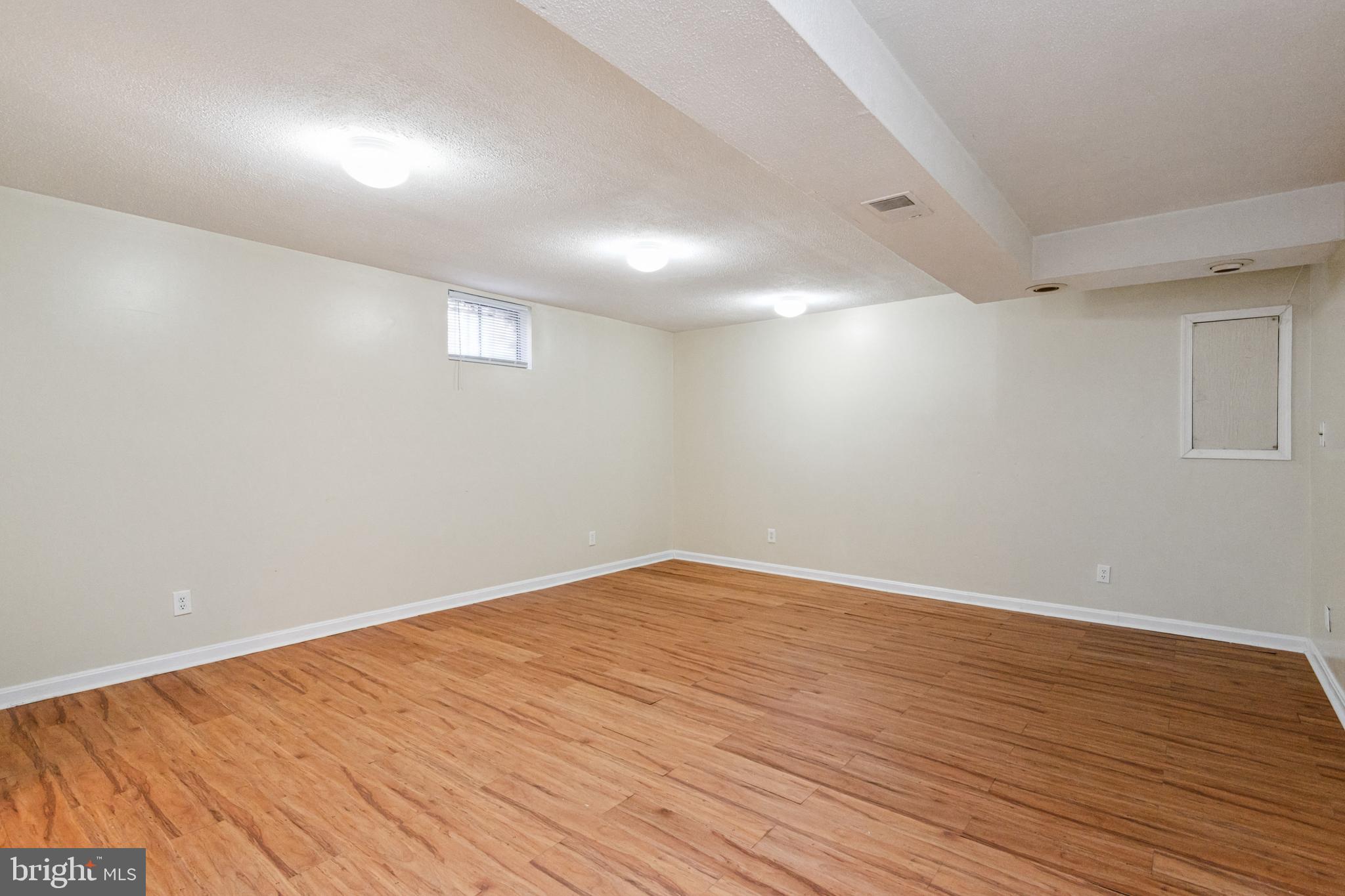 7419 Bentree Road Fort Washington, MD 20744 - Photo 18 of 31 a view of empty room with wooden floor