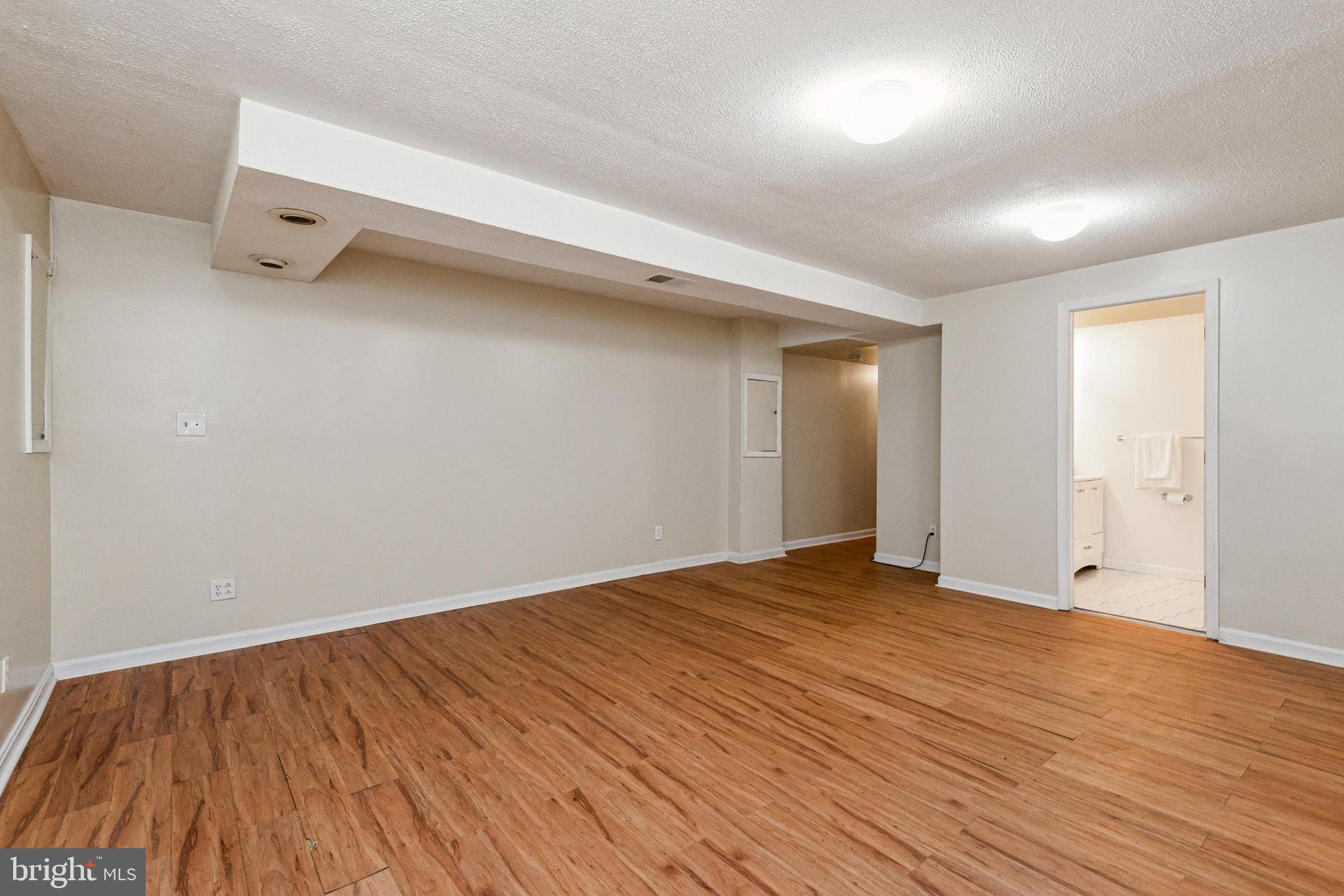 7419 Bentree Road Fort Washington, MD 20744 - Photo 19 of 31 wooden floor in an empty room with a window