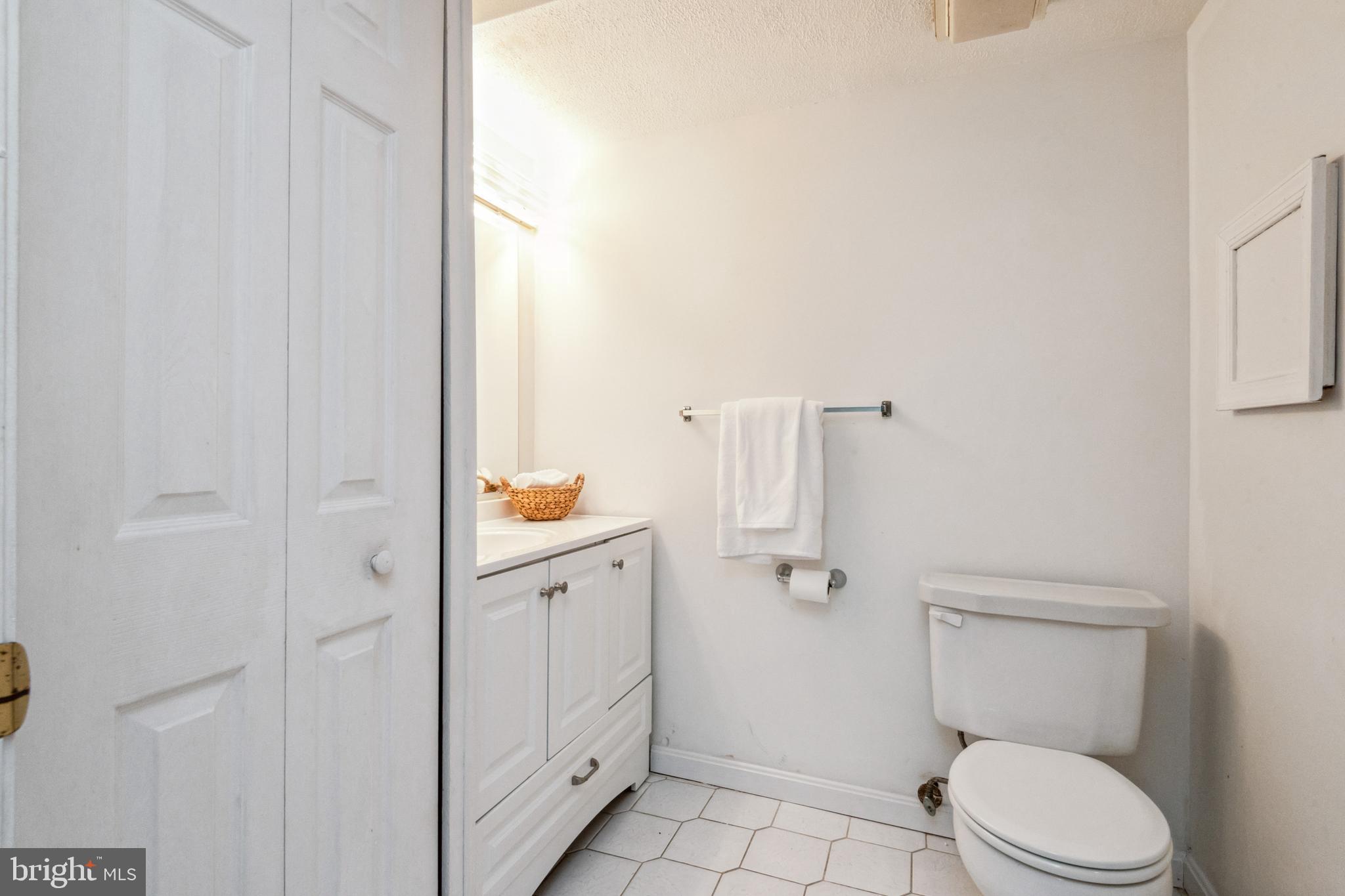 7419 Bentree Road Fort Washington, MD 20744 - Photo 20 of 31 a bathroom with a toilet a sink and shower