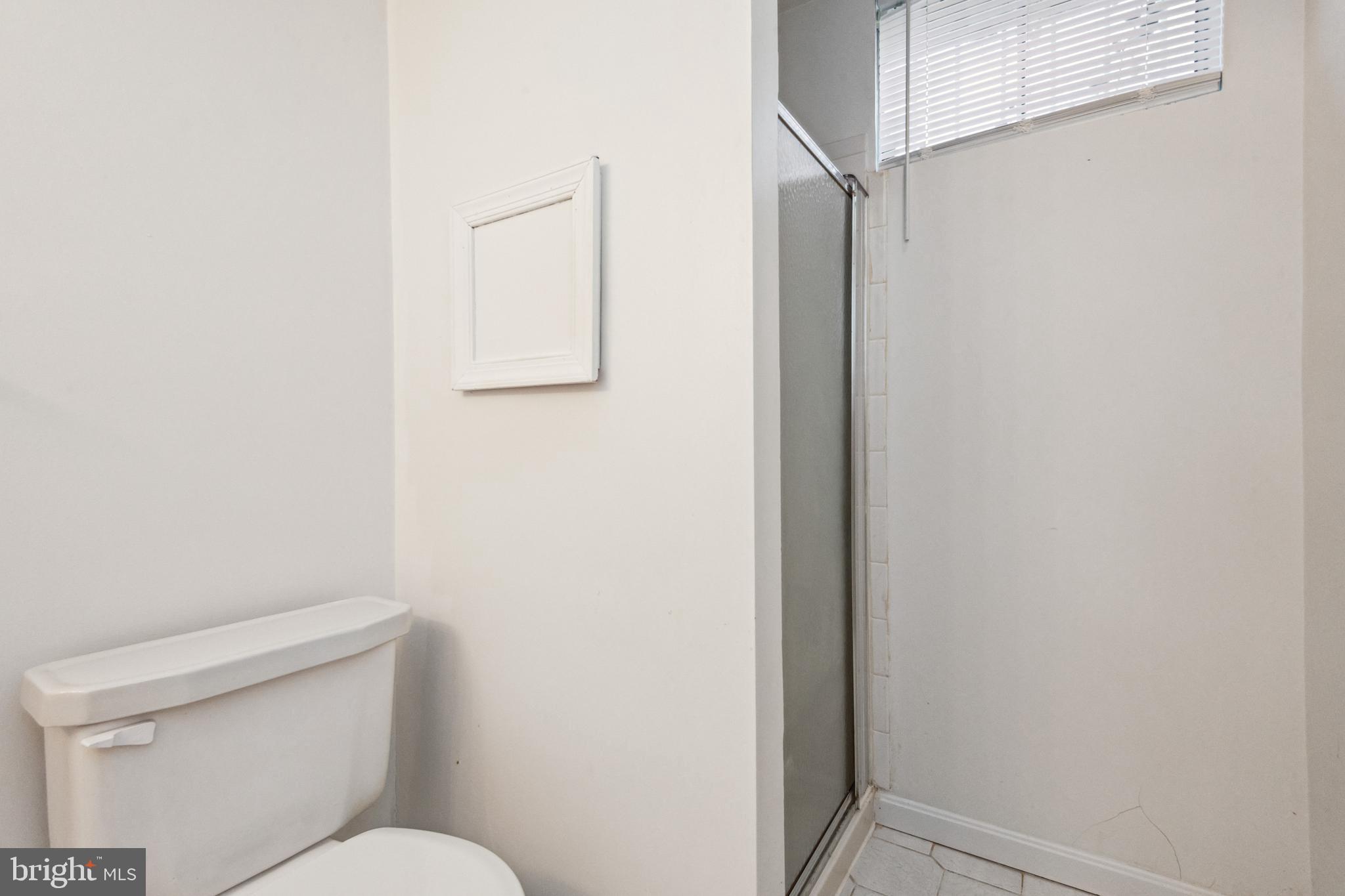 7419 Bentree Road Fort Washington, MD 20744 - Photo 21 of 31 a bathroom with a toilet