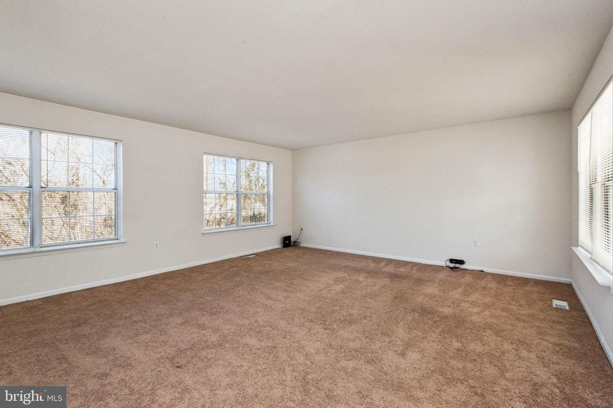 7419 Bentree Road Fort Washington, MD 20744 - Photo 5 of 31 a view of an empty room with a window