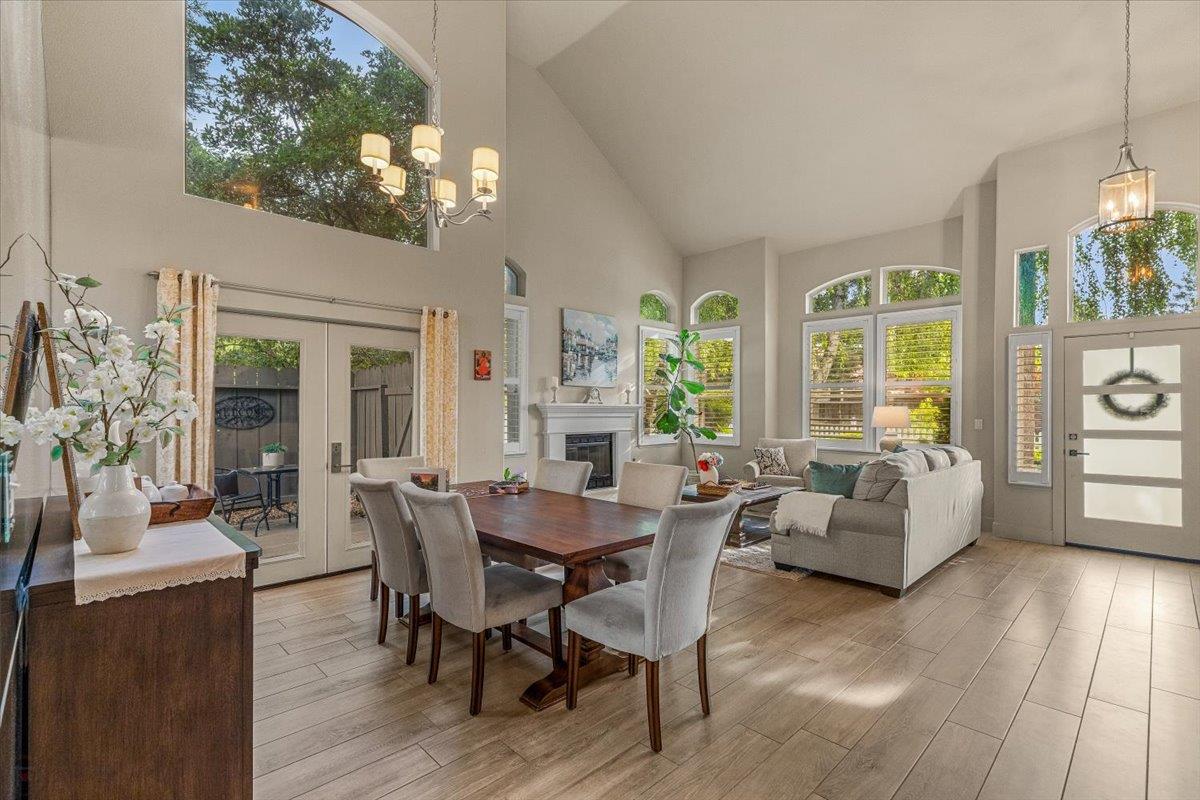2485 Tigers Drive Turlock, CA 95382 - Photo 13 of 77 a view of a dining room with furniture large windows and wooden floor
