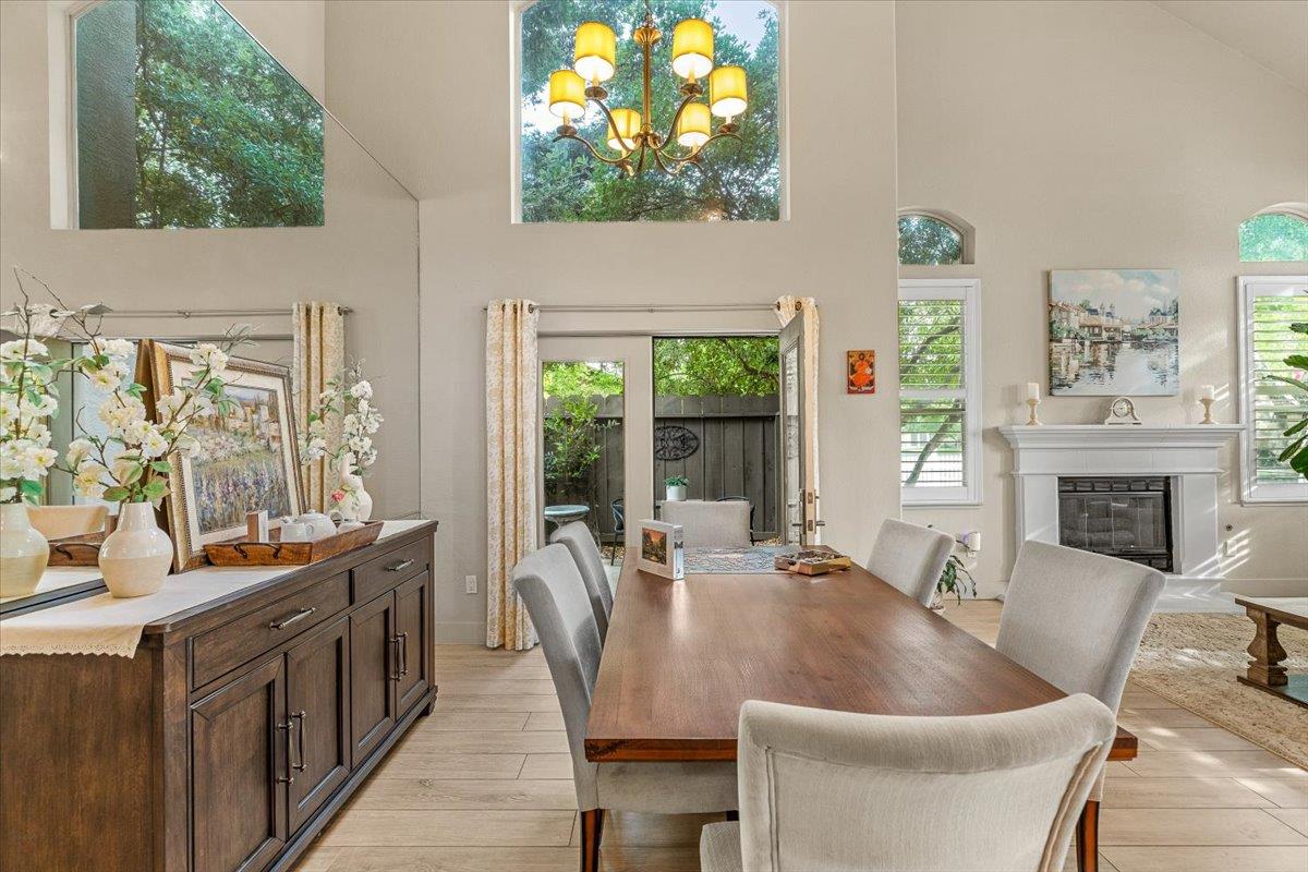 2485 Tigers Drive Turlock, CA 95382 - Photo 20 of 77 a dining room with furniture a window and a fireplace