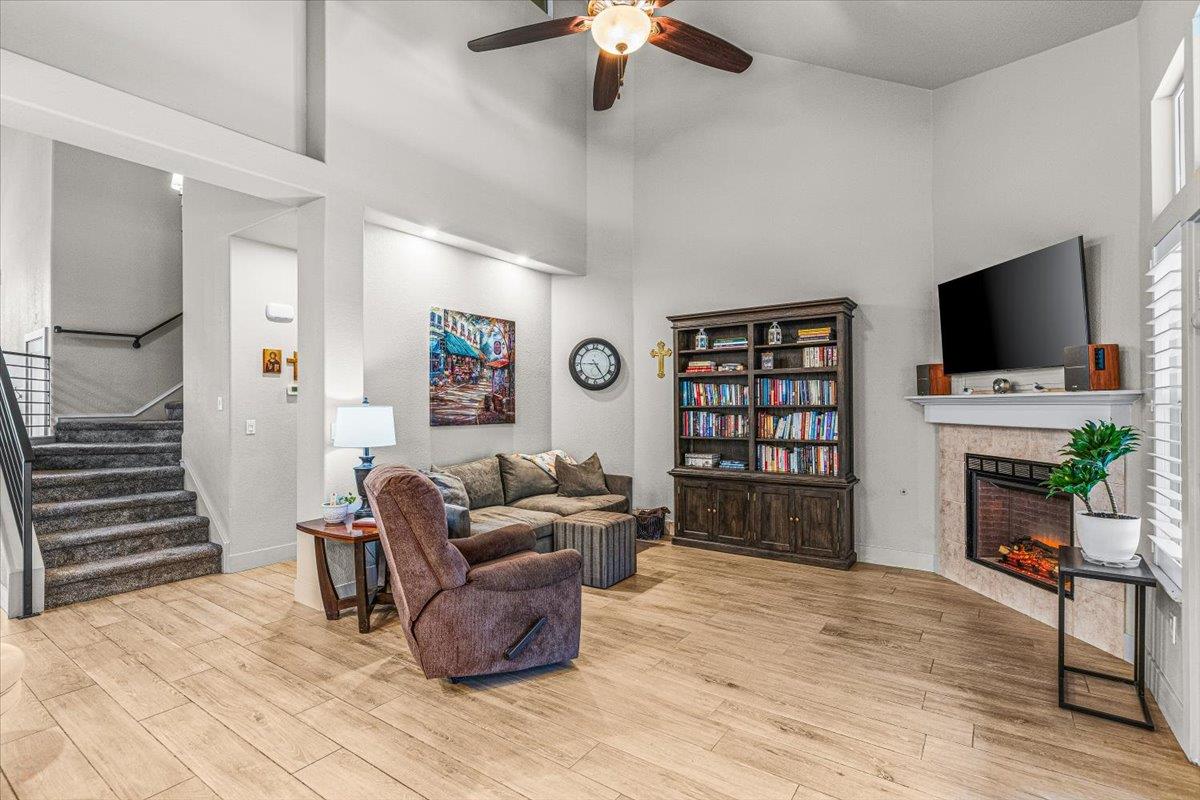 2485 Tigers Drive Turlock, CA 95382 - Photo 33 of 77 a living room with furniture a flat screen tv and a fireplace