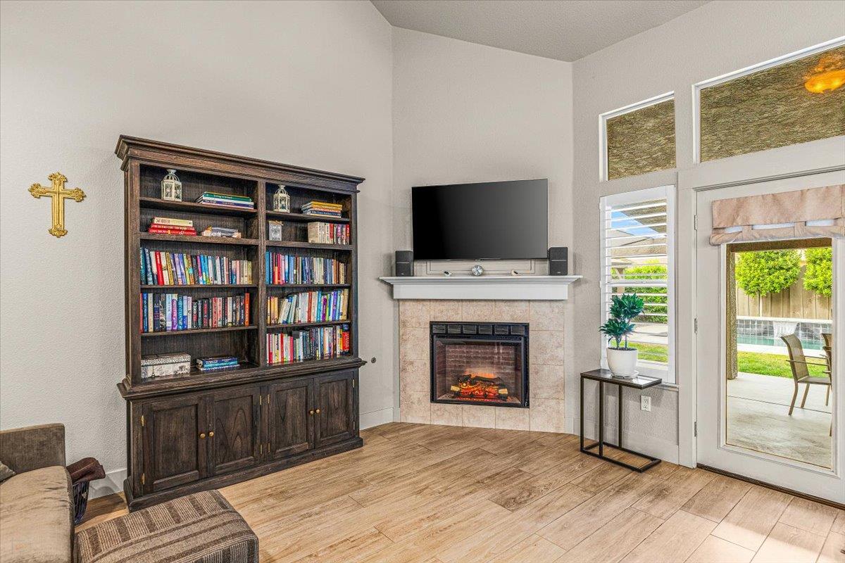 2485 Tigers Drive Turlock, CA 95382 - Photo 35 of 77 a living room with furniture fireplace and flat screen tv