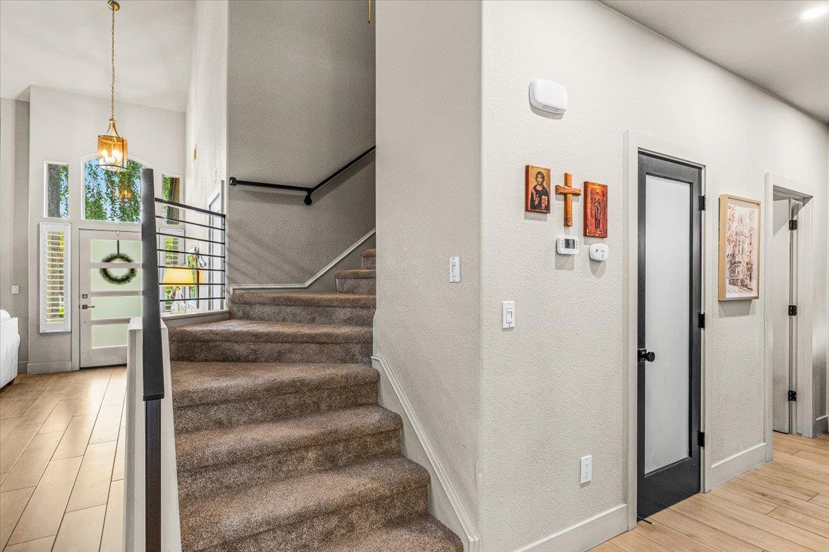 2485 Tigers Drive Turlock, CA 95382 - Photo 46 of 77 a view of a hallway with wooden floor and entryway