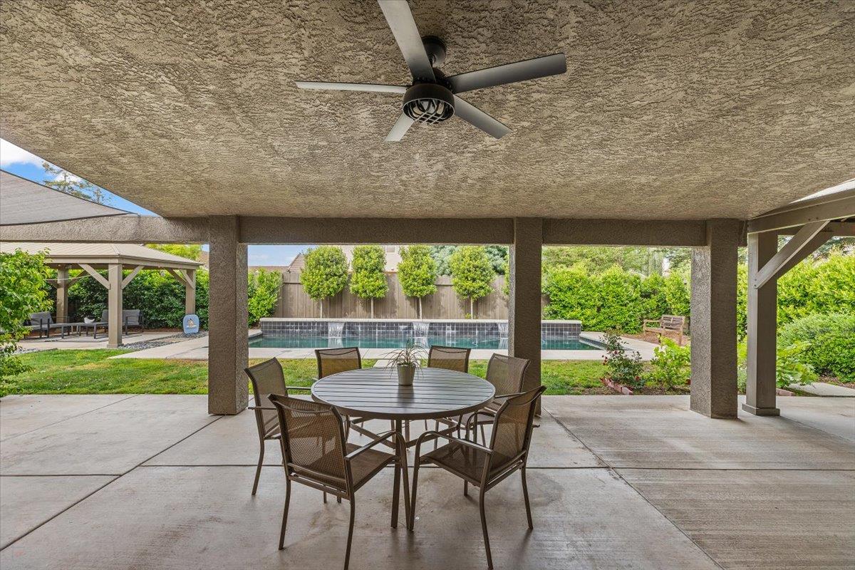 2485 Tigers Drive Turlock, CA 95382 - Photo 56 of 77 a dining room with furniture and a yard