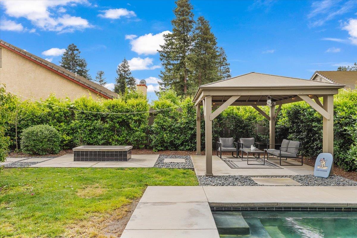 2485 Tigers Drive Turlock, CA 95382 - Photo 69 of 77 a view of a house with backyard and sitting area