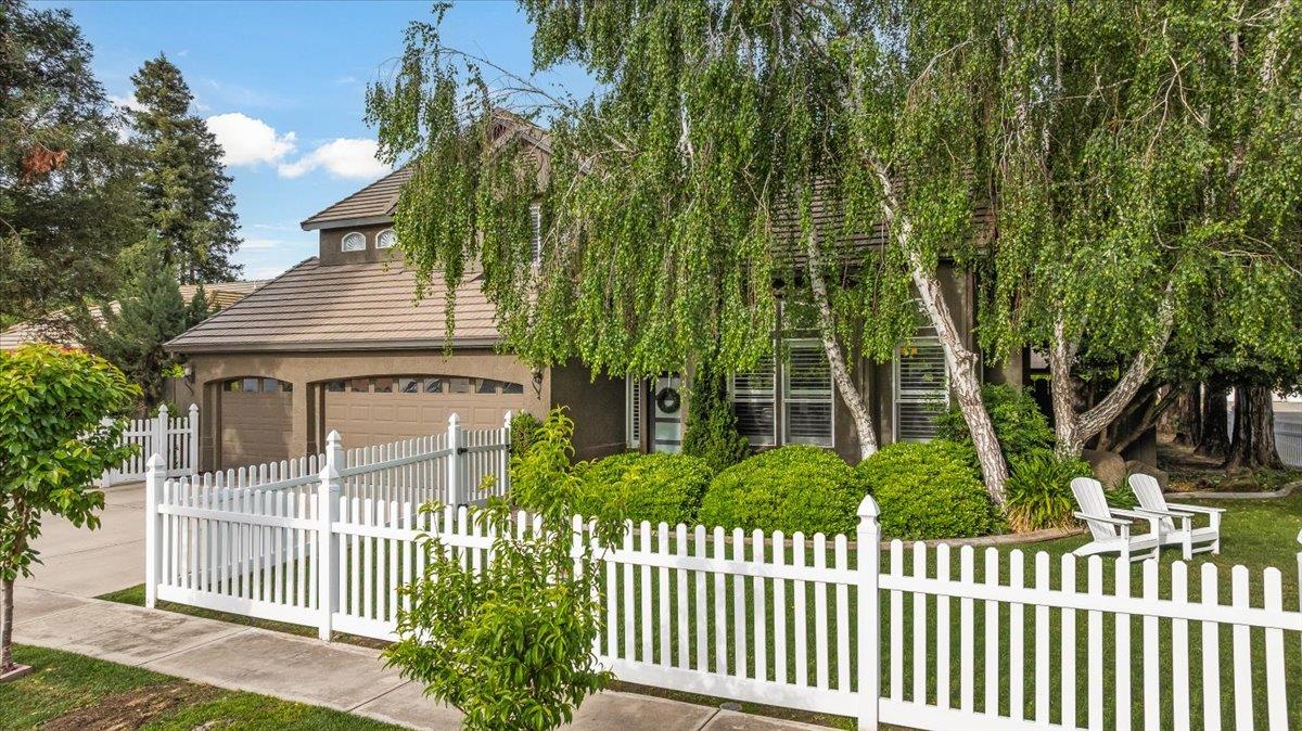 2485 Tigers Drive Turlock, CA 95382 - Photo 7 of 77 a front view of a house with a garden