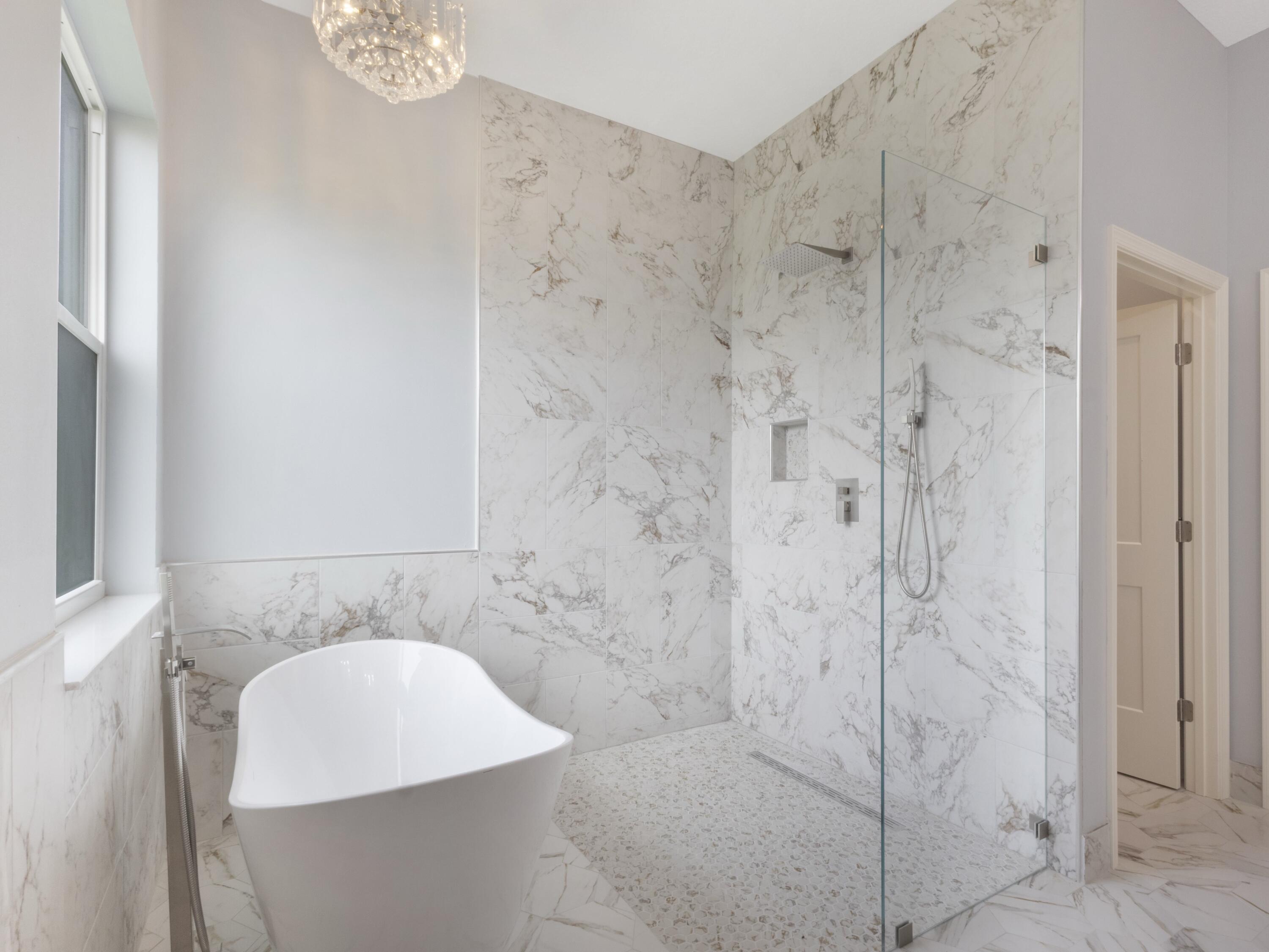 17436 71st Lane North Loxahatchee, FL 33470 - Photo 31 of 50 a bathroom with a shower and a sink
