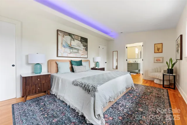 a bedroom with bed and a table