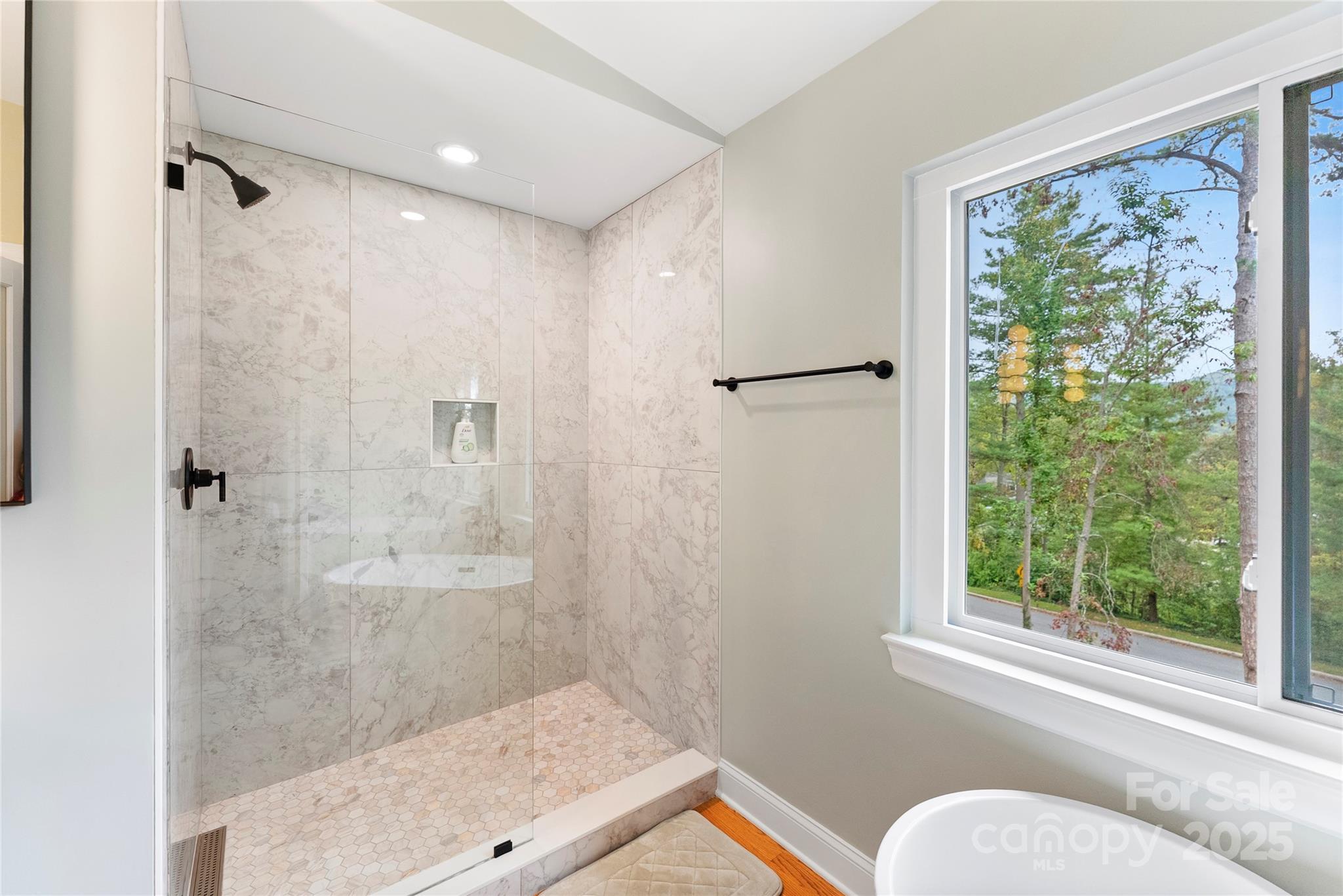 351 Windsor Road Asheville, NC 28804 - Photo 19 of 42 a bathroom with a shower and a window