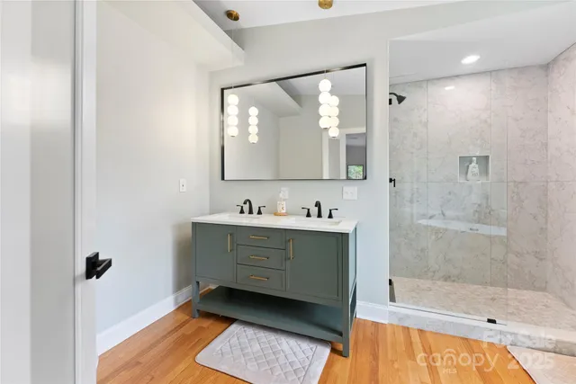 a bathroom with a sink mirror and a bathtub