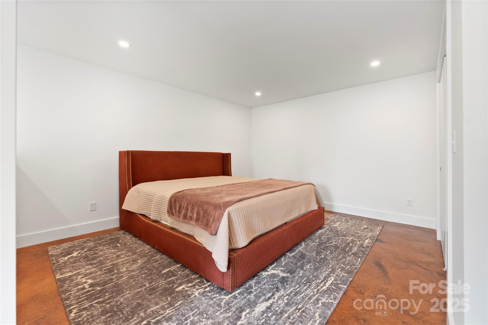 351 Windsor Road Asheville, NC 28804 - Photo 29 of 42 a bedroom with a bed and a rug