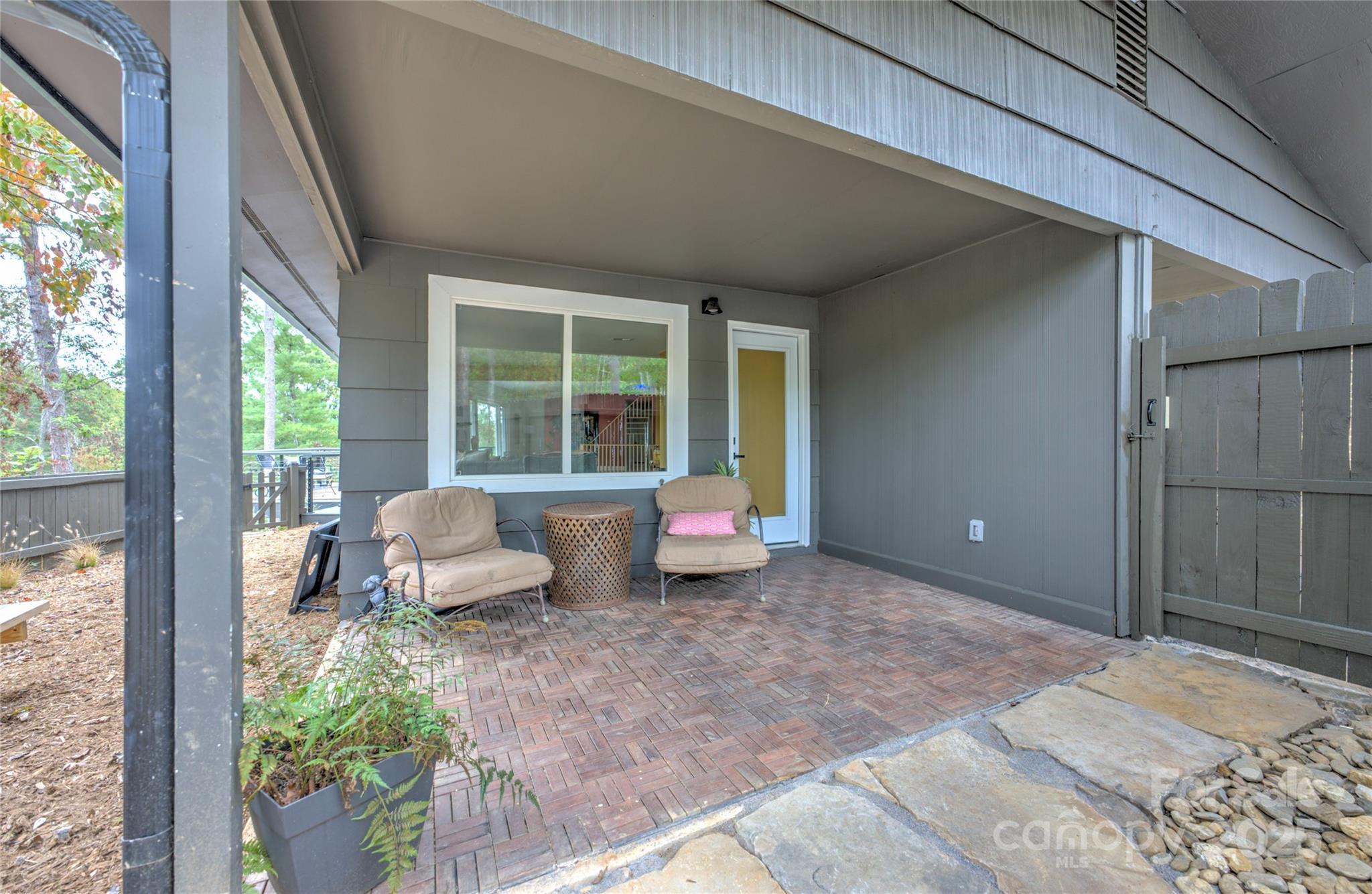 351 Windsor Road Asheville, NC 28804 - Photo 35 of 42 a bedroom with furniture and a large window