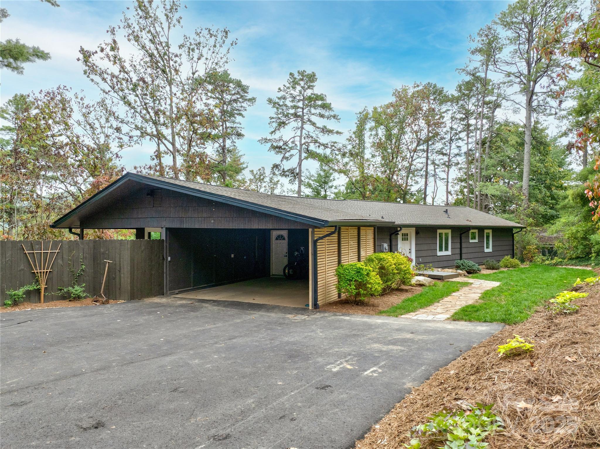 351 Windsor Road Asheville, NC 28804 - Photo 37 of 42 a front view of a house with a yard and garage