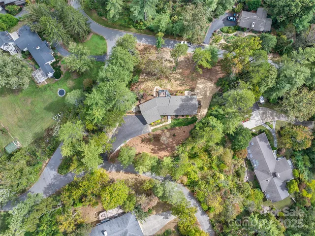 an aerial view of a houses with outdoor space and street view