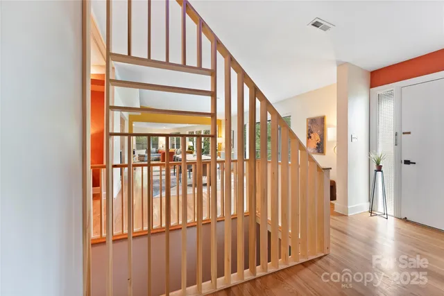 a view of staircase with railing and stairs