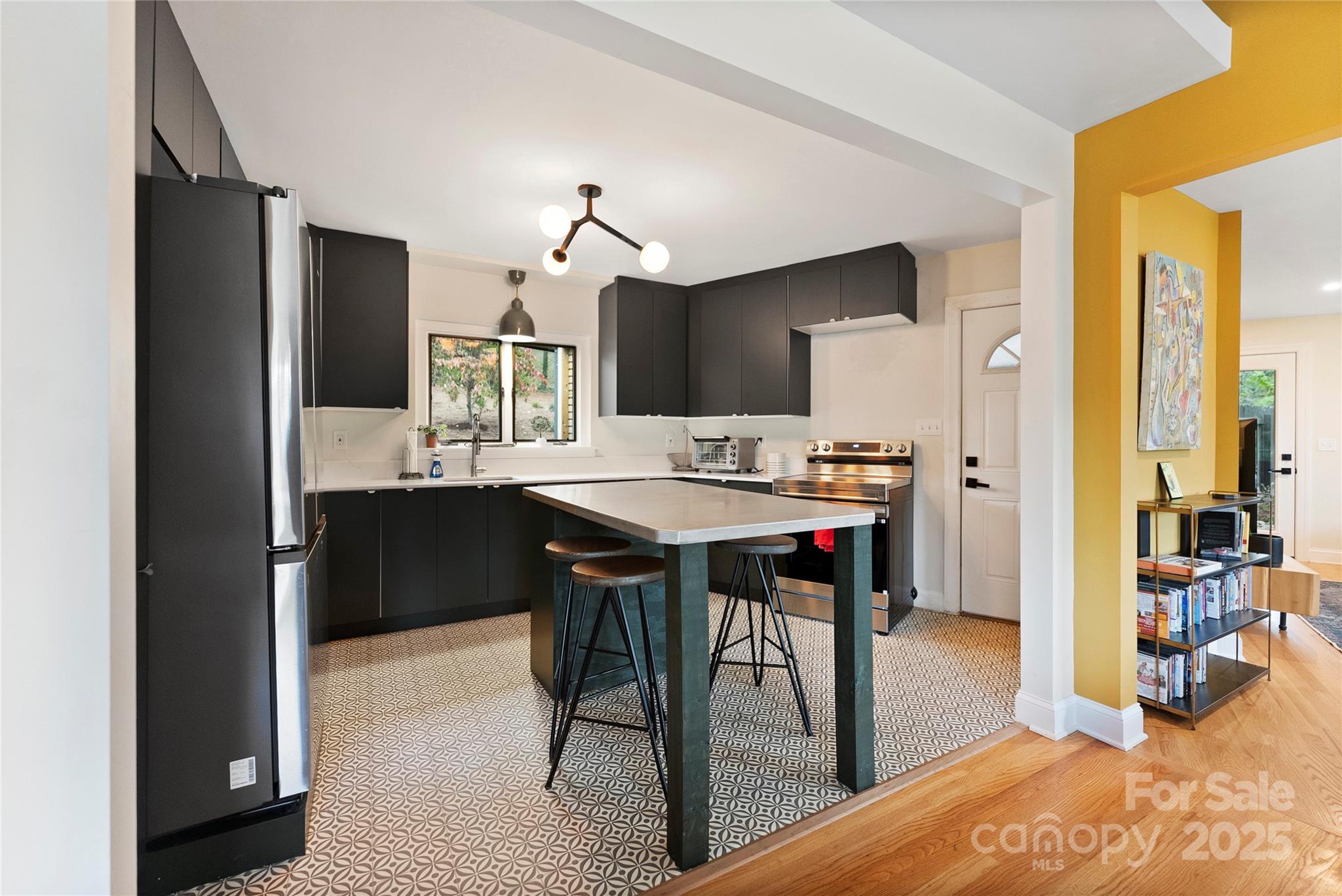 351 Windsor Road Asheville, NC 28804 - Photo 8 of 42 a kitchen with kitchen island a dining table and chairs