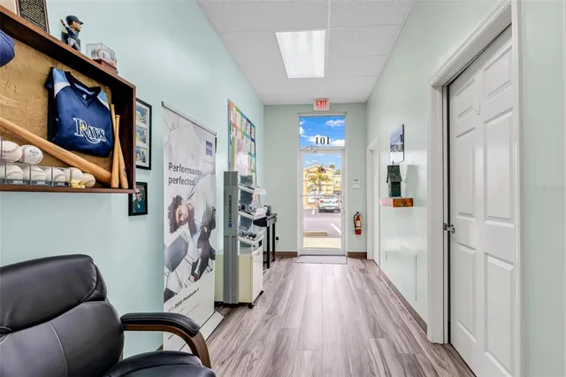a view of a livingroom with furniture and hardwood floor