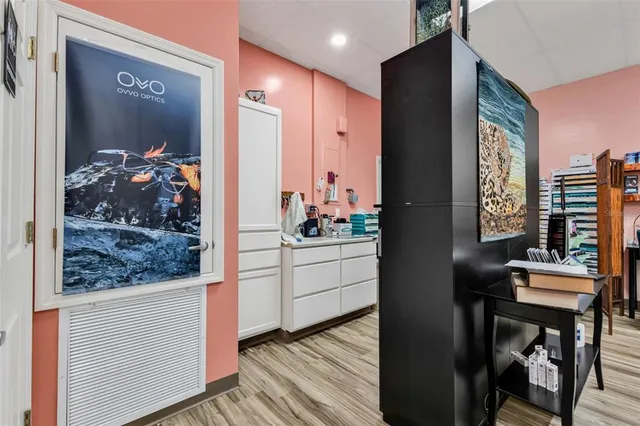 a view of a hallway and a dining room with furniture