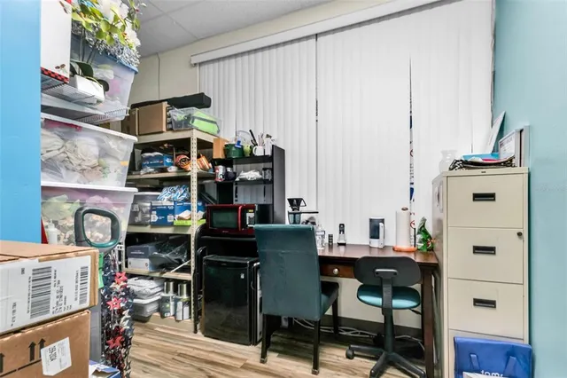 a view of a dining room with workspace and a window