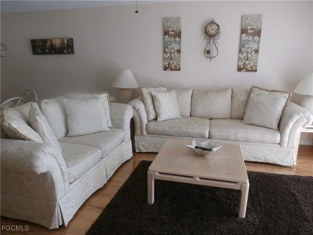 a living room with furniture and a couch