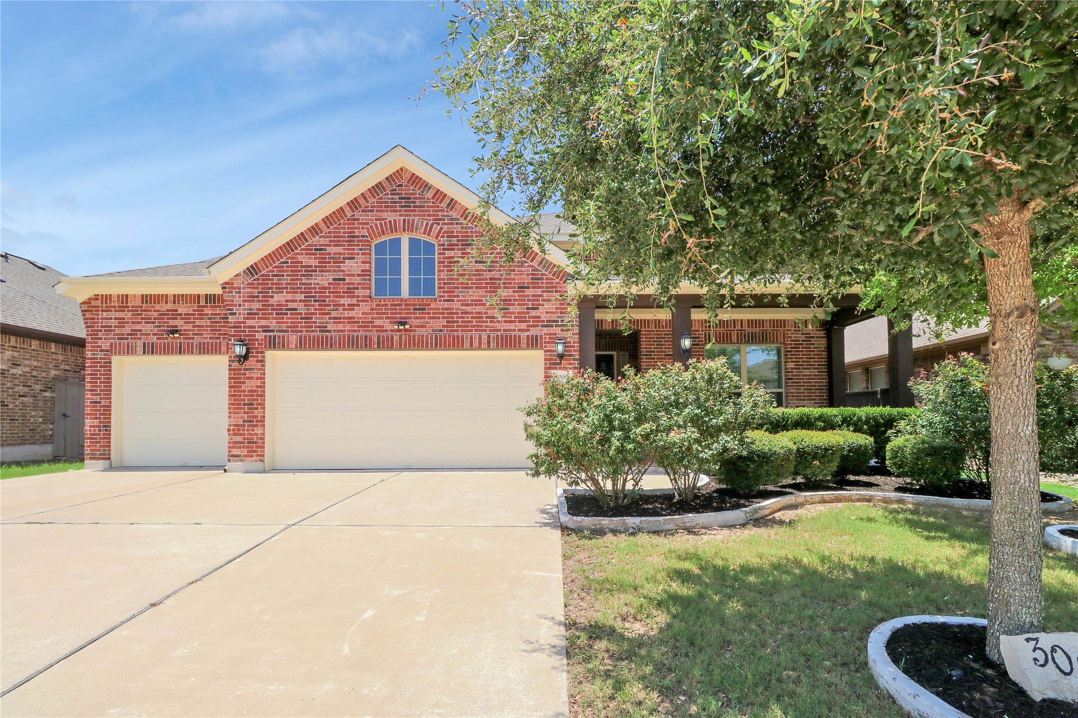 3009 Silvergrass Cove Leander, TX 78641 - Photo 1 of 1 A classic brick facade welcomes you home, boasting a neatly manicured lawn and attached garage.