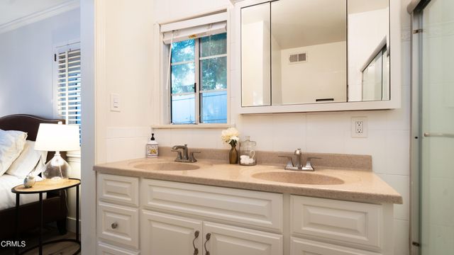 a bedroom with a bed and a table with chair