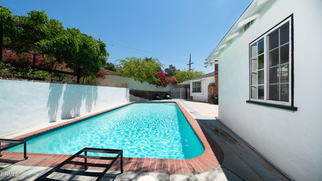 a view of a chairs and table in a patio