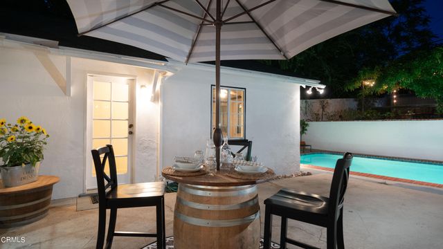 a view of a chairs and table in the patio