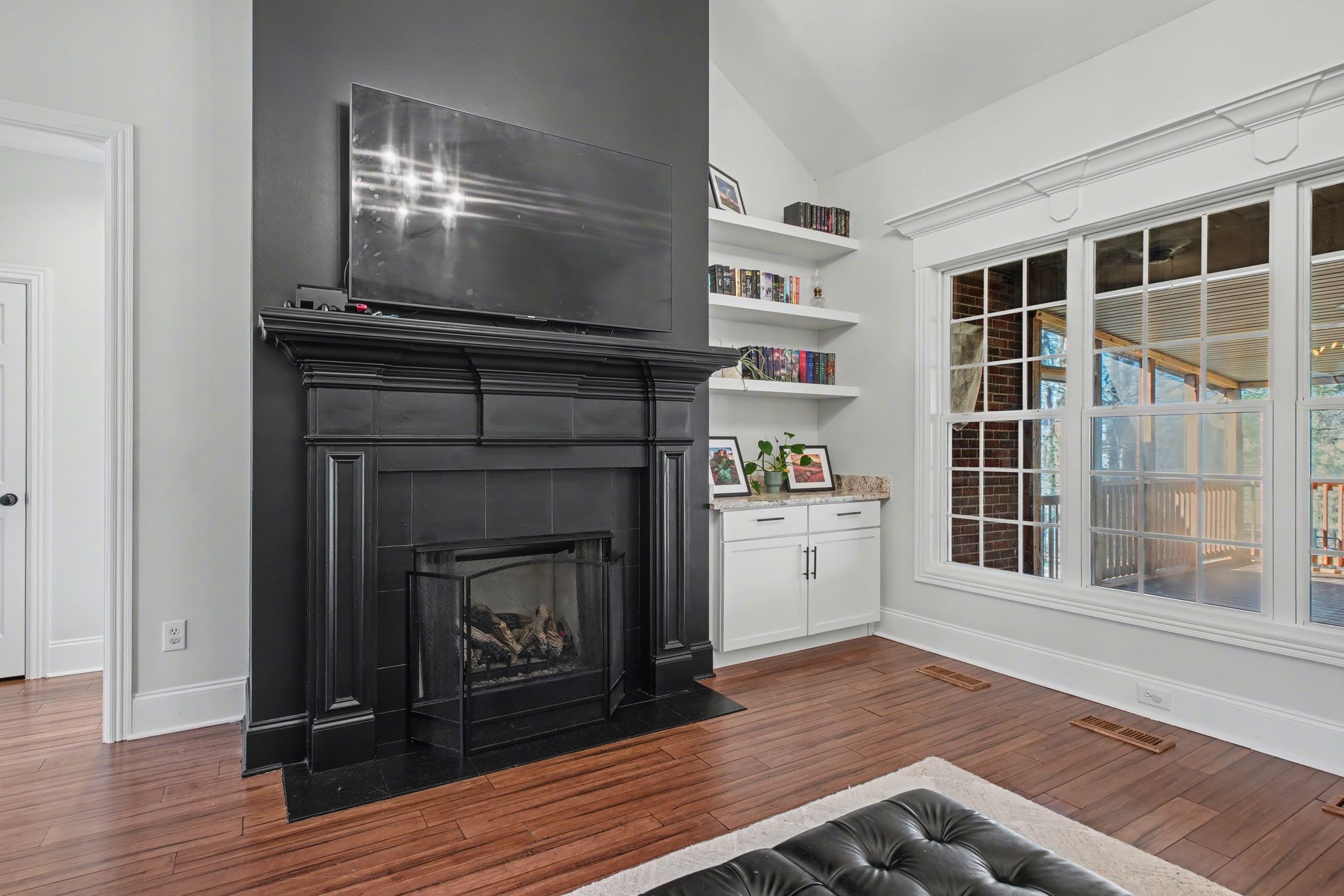 701 Deer Ridge Lane Lebanon, TN 37087 - Photo 12 of 41 a living room with a fireplace and wooden floor