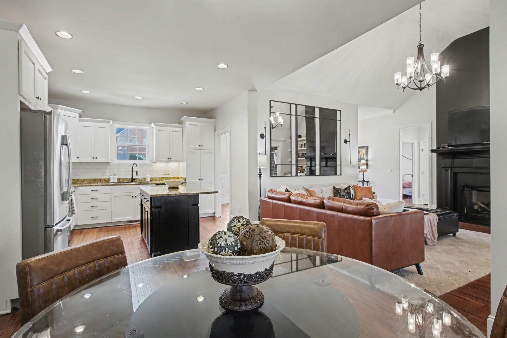 701 Deer Ridge Lane Lebanon, TN 37087 - Photo 15 of 41 a living room with stainless steel appliances furniture a chandelier and a view of kitchen