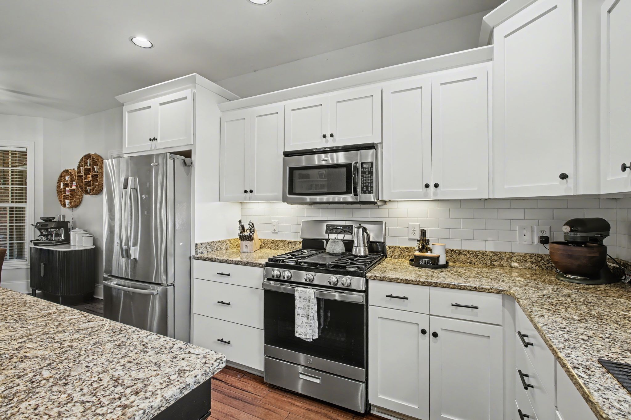 701 Deer Ridge Lane Lebanon, TN 37087 - Photo 18 of 41 a kitchen with white cabinets and stainless steel appliances