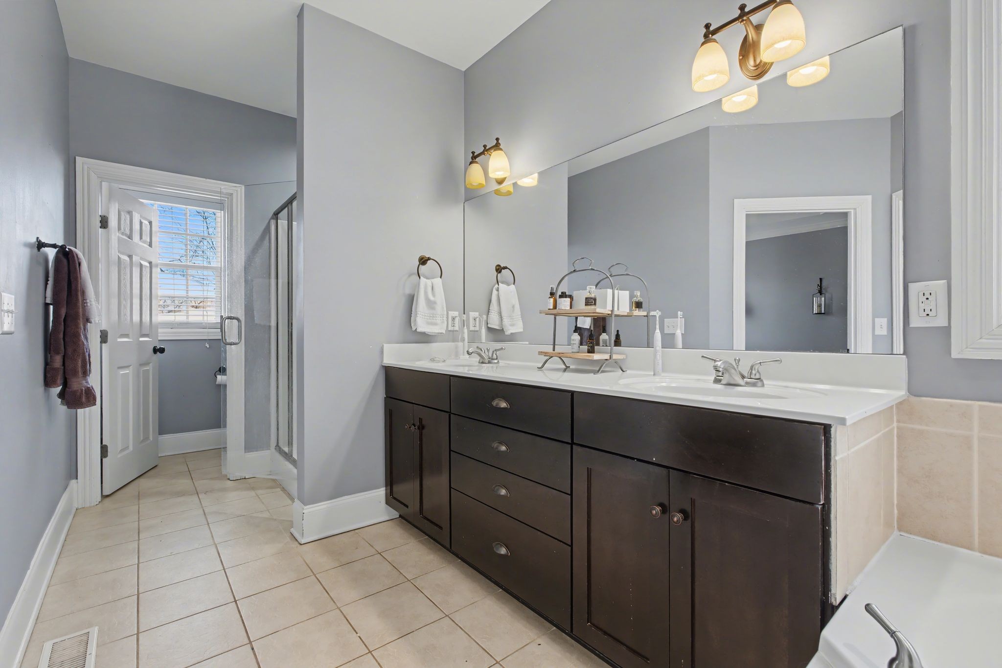 701 Deer Ridge Lane Lebanon, TN 37087 - Photo 22 of 41 a bathroom with a sink vanity and a mirror