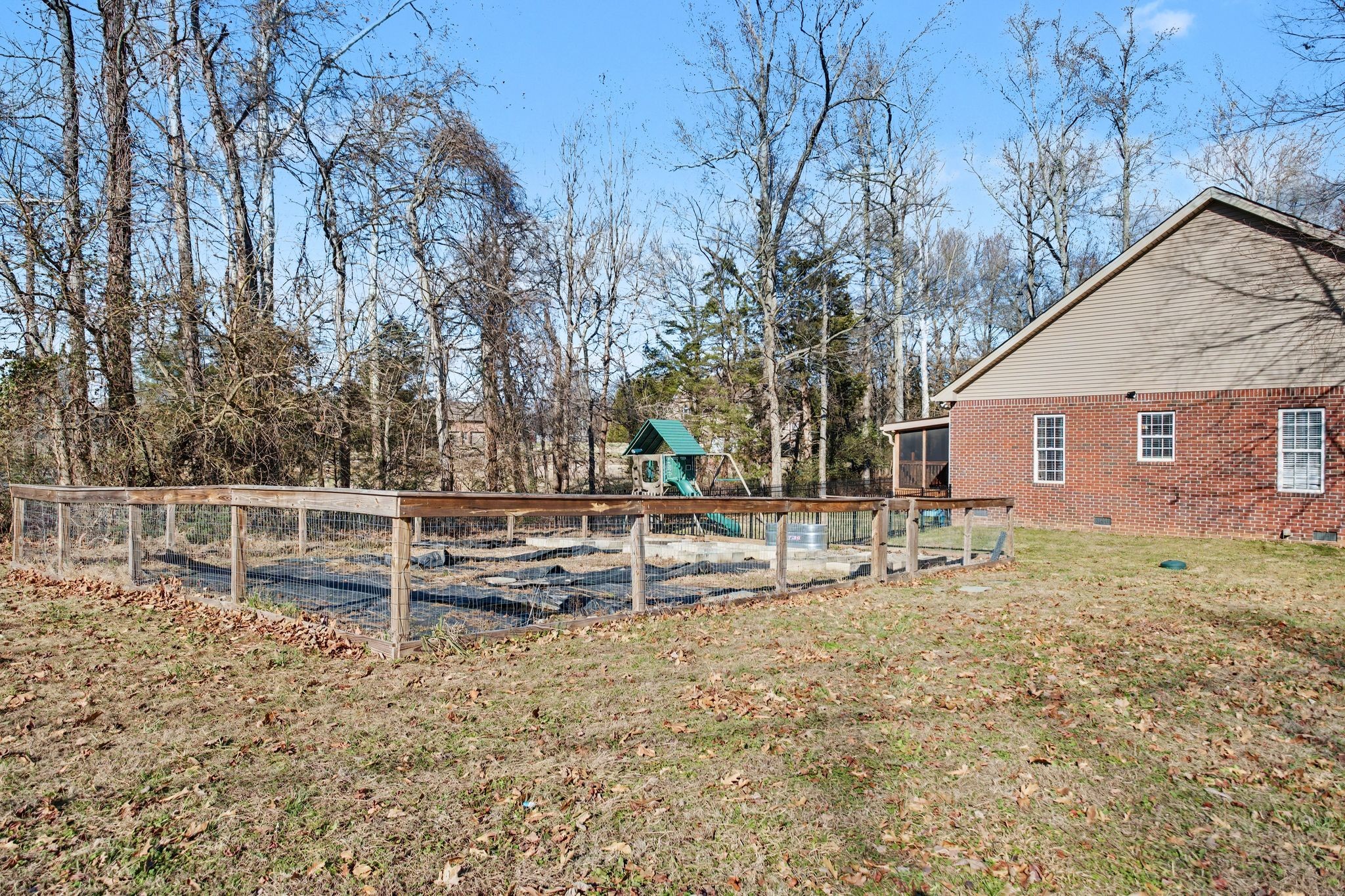 701 Deer Ridge Lane Lebanon, TN 37087 - Photo 37 of 41 a view of backyard with wooden fence and large trees