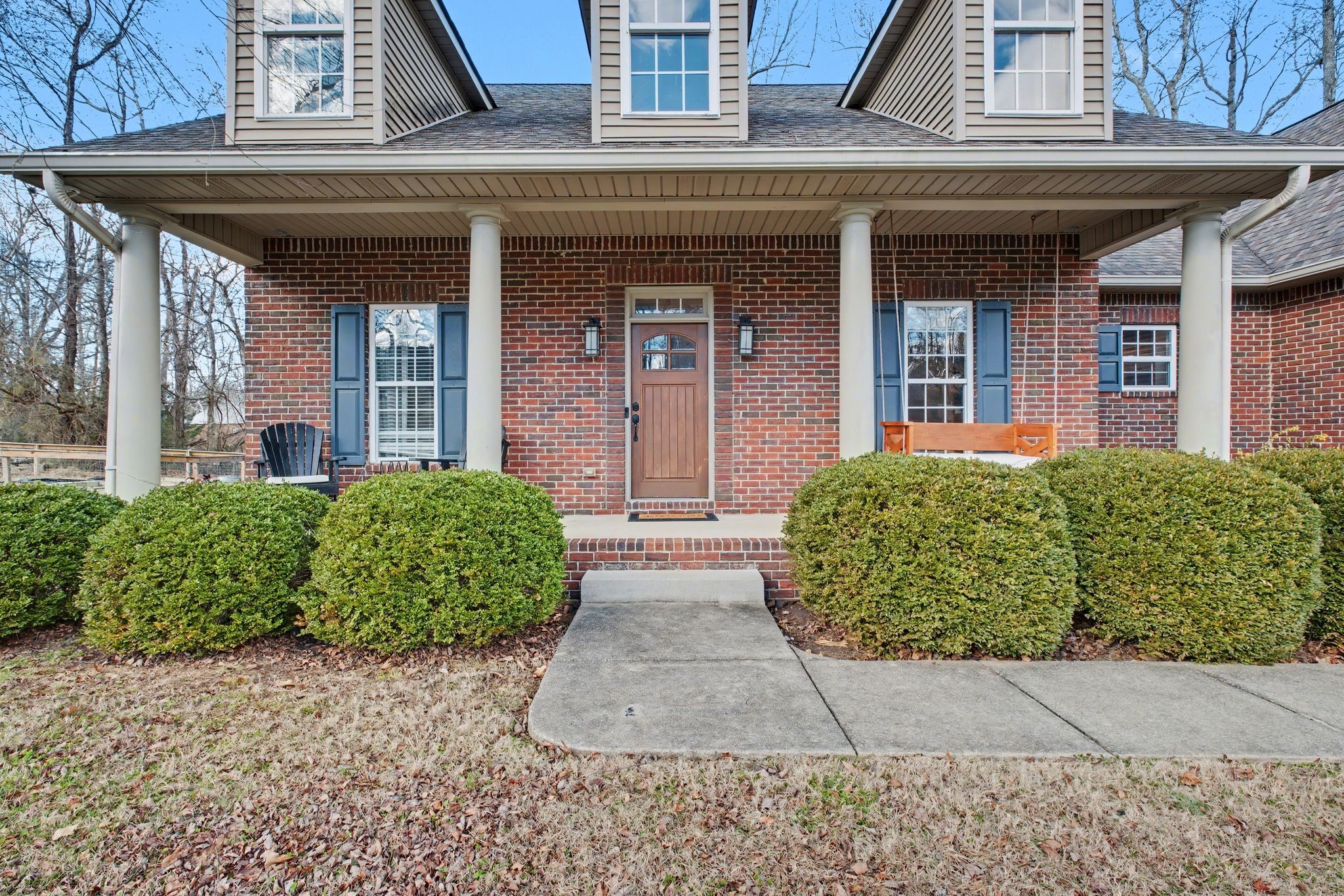 701 Deer Ridge Lane Lebanon, TN 37087 - Photo 4 of 41 a view of a brick house with potted plants