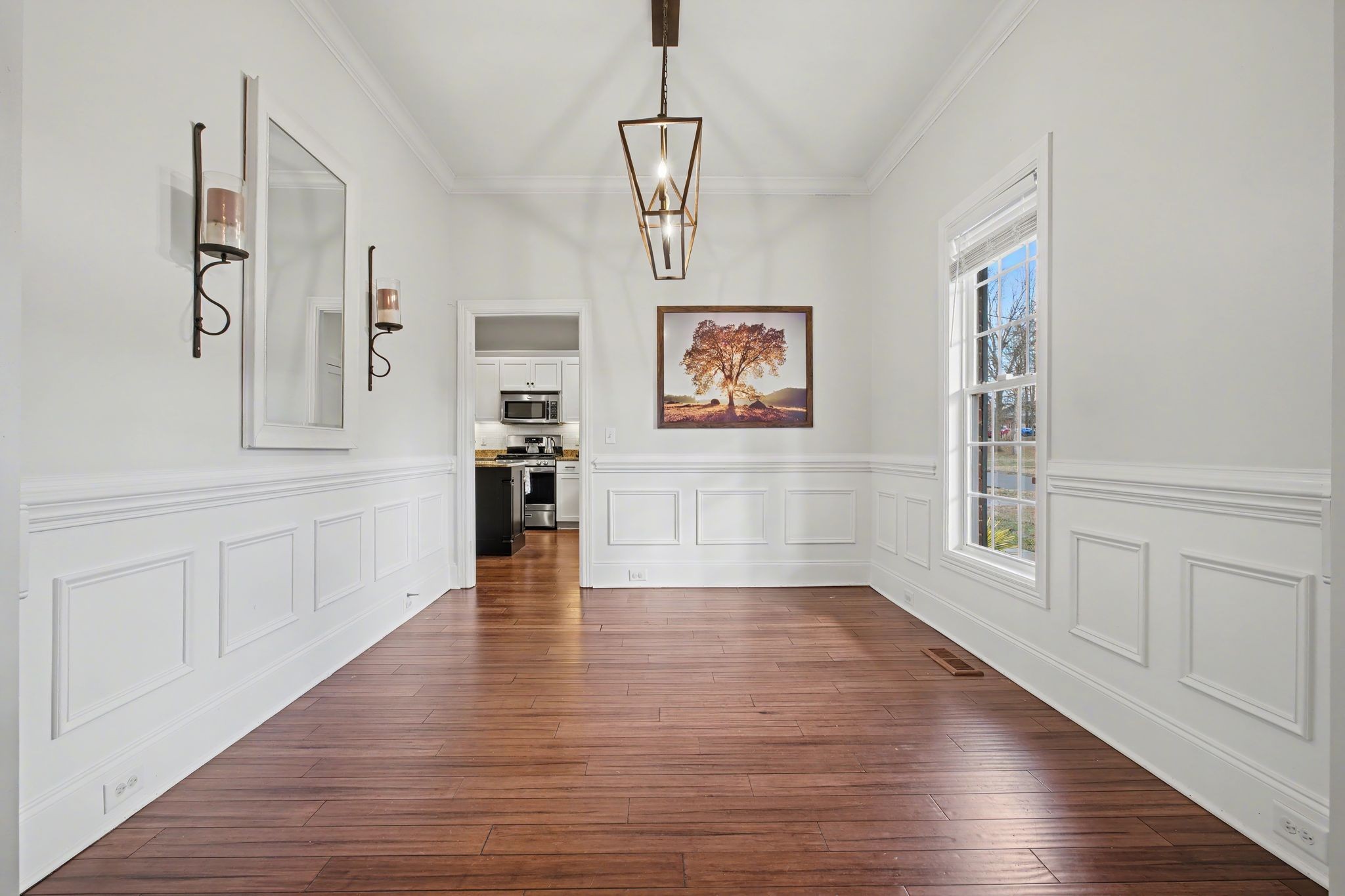 701 Deer Ridge Lane Lebanon, TN 37087 - Photo 7 of 41 a view of an empty room with window and wooden floor