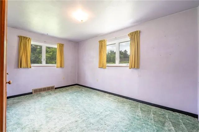 an empty room with closet area