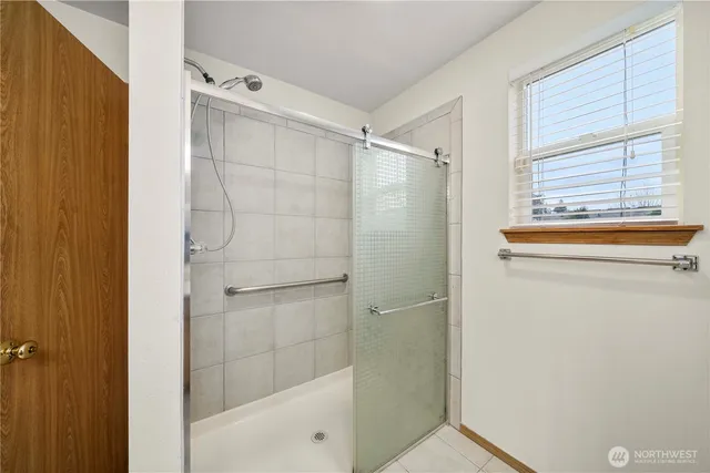 a bathroom with a bathtub and a shower