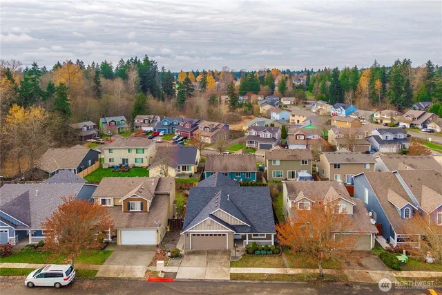 a view of multiple houses with a city street
