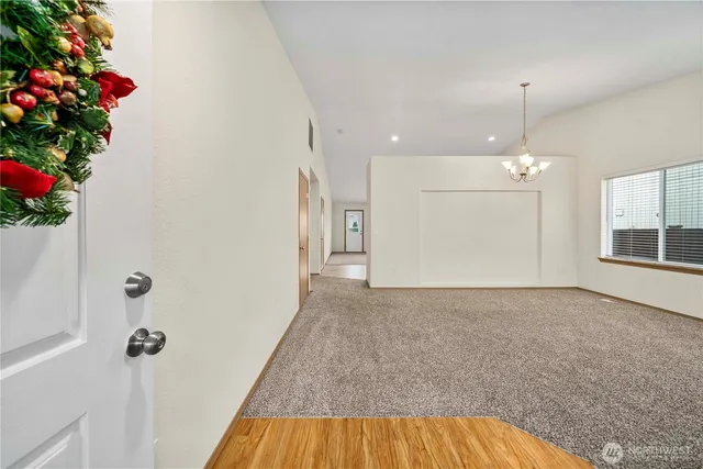 a view of a kitchen and an entryway